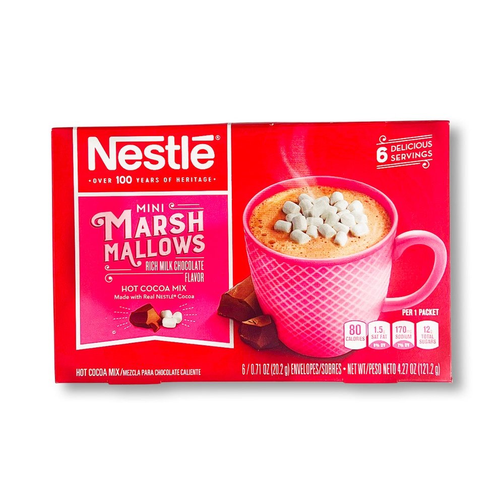 Un carton rouge sur fond blanc avec une tasse rose remplie d’une boisson chaude brune avec au-dessus des mini marshmallows. A gauche 2 morceaux de chocolat 