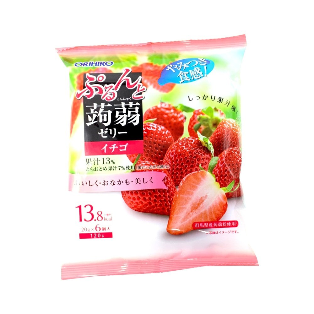 Un paquet rose et blanc avec des fraises rouges, le tout sur fond blanc