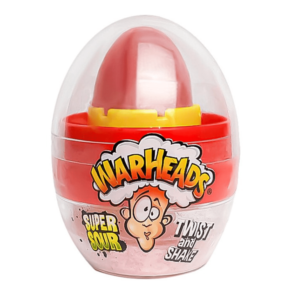 Un emballage en forme d’oeufs transparents avec à l’intérieur un bonbon rouge à sucer, il y a un visage qui a la tête qui explose. Le tout sur fond blanc