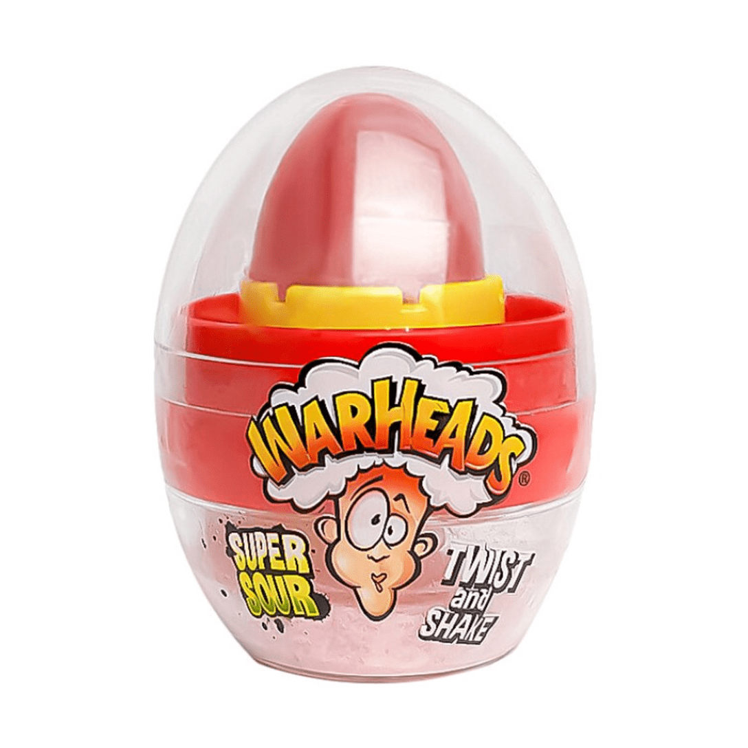 Un emballage en forme d’oeufs transparents avec à l’intérieur un bonbon rouge à sucer, il y a un visage qui a la tête qui explose. Le tout sur fond blanc