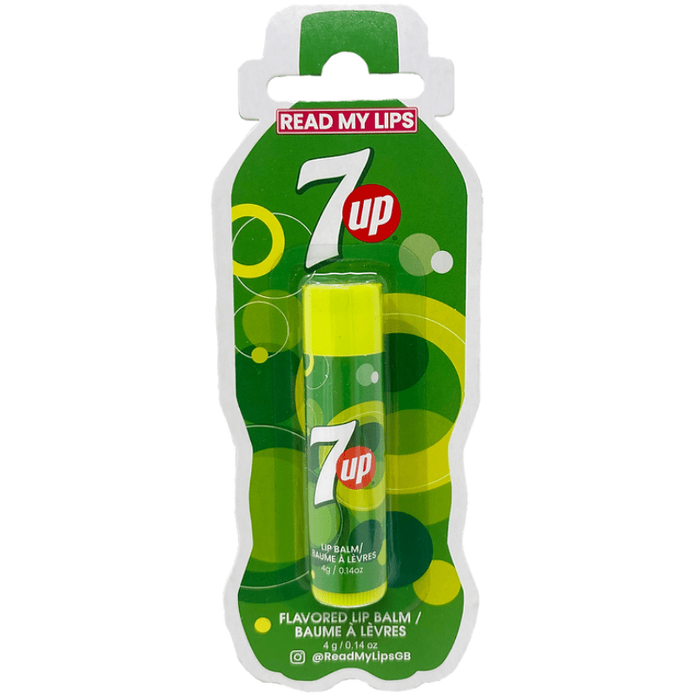 Un baume à lèvres vert dans son emballage en forme de bouteille. Il y a plein de motifs en forme de cercles de différents tons de vert 